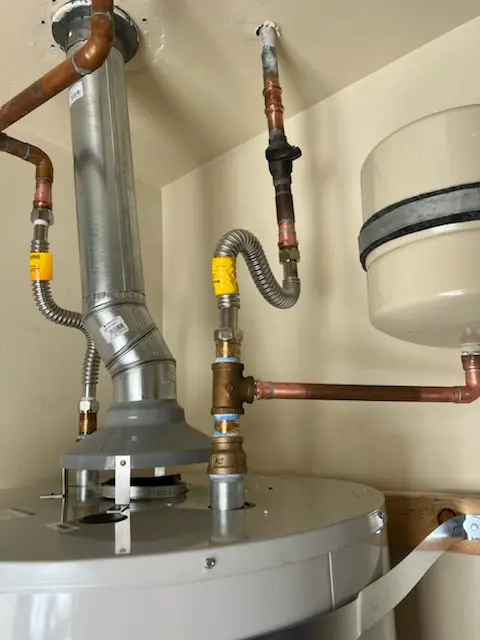 Water heater installation and plumbing repair in De Witt